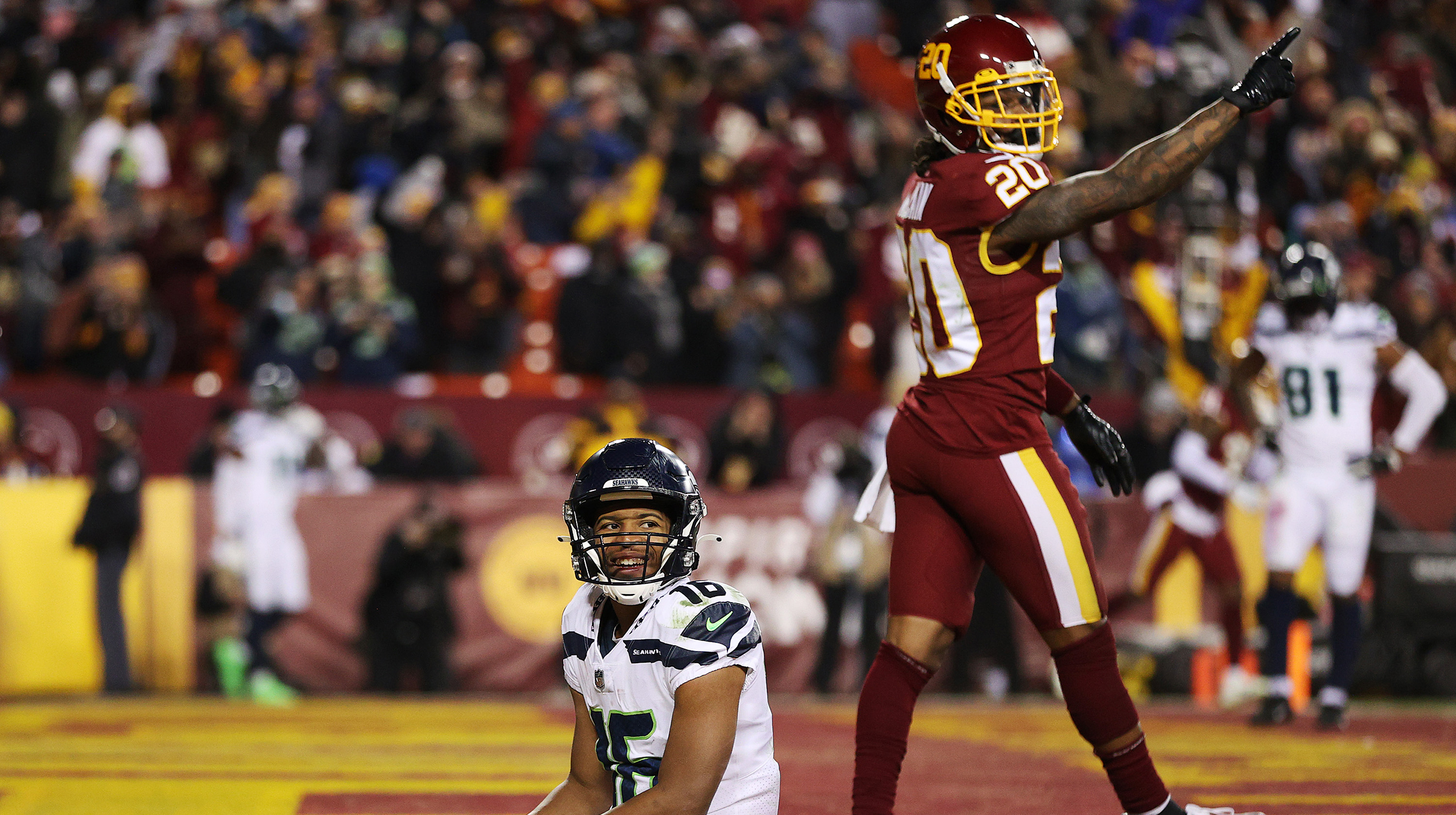 Tyler Lockett #16 of the Seattle Seahawks reacts after a failed two point conversion against the Washington Football Team during the fourth quarter at FedExField on November 29, 2021 in Landover, Maryland.