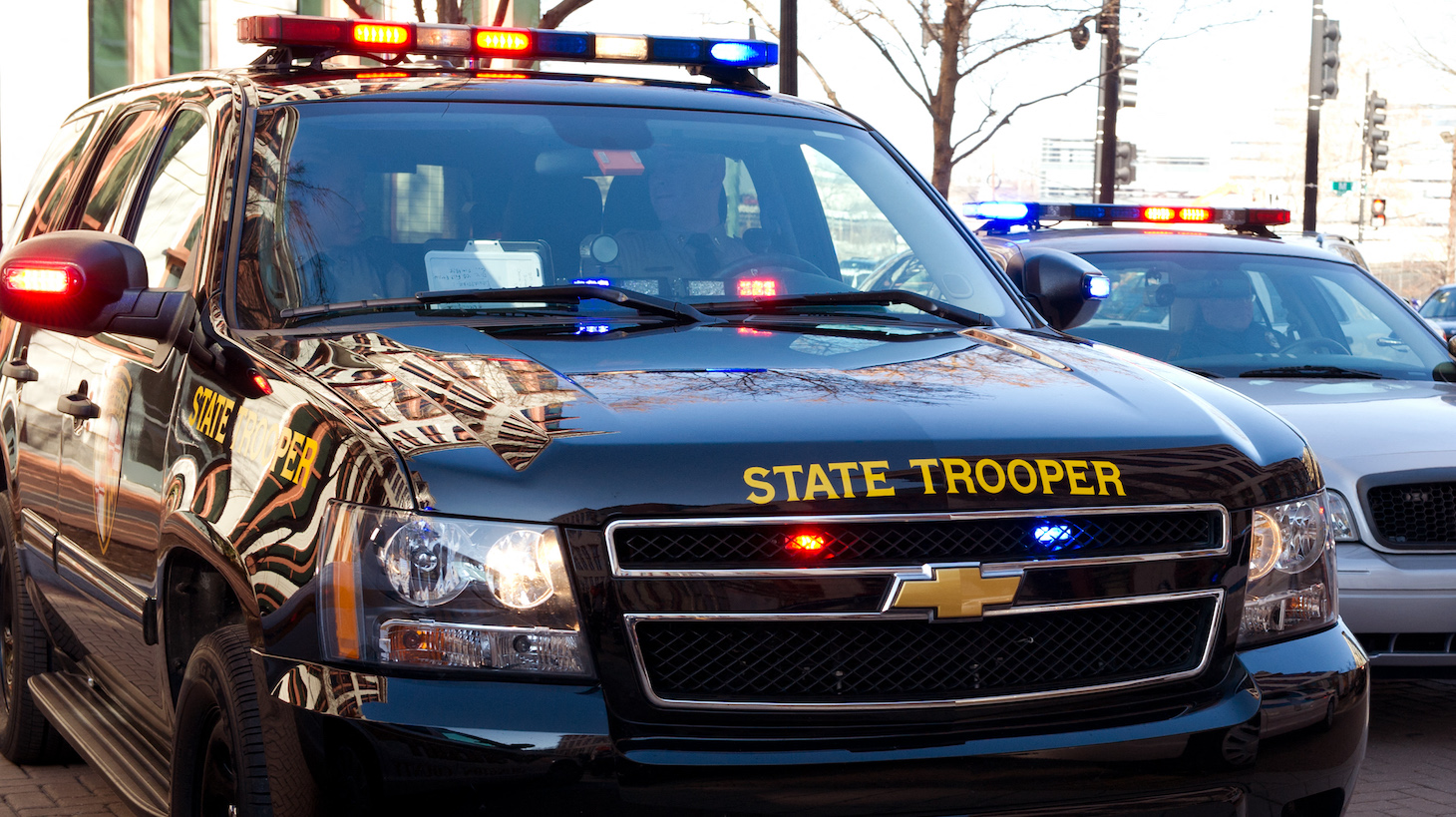 This December 13, 2012 photo shows Maryland State Troopers in their vehicle during an event at the US Department of Transportation in Washington, DC. AFP PHOTO/Karen BLEIER (Photo by KAREN BLEIER / AFP) (Photo by KAREN BLEIER/AFP via Getty Images)