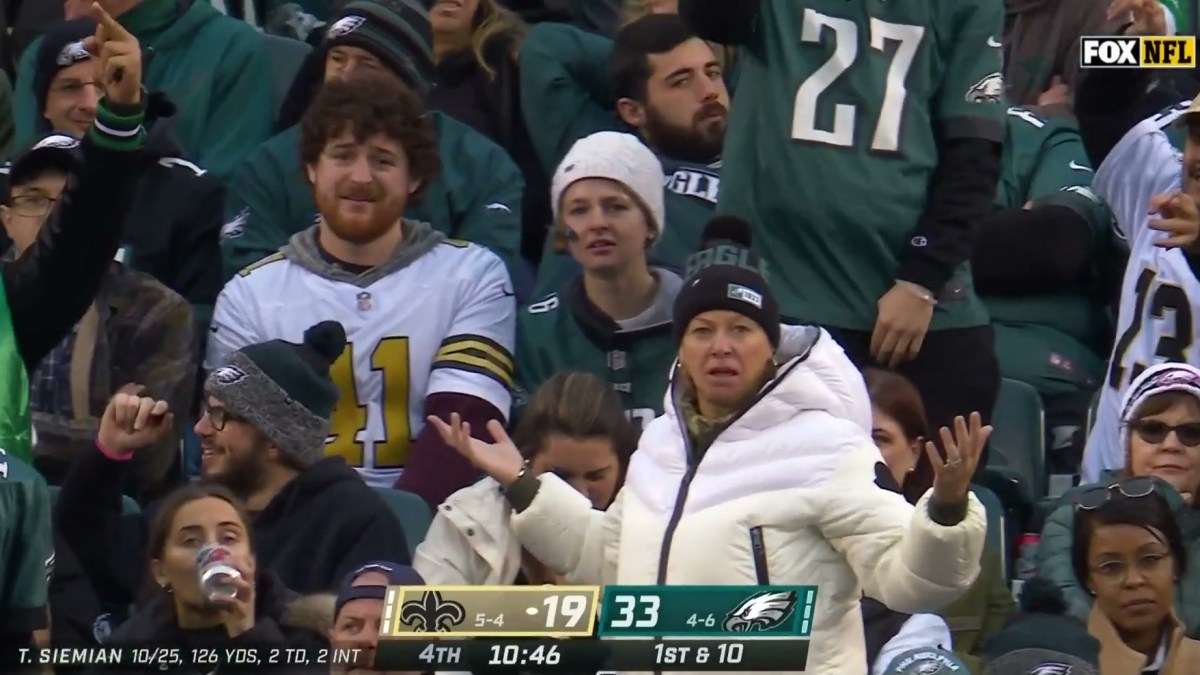 An Eagles fan puts her hands up in a "WHAT" motion
