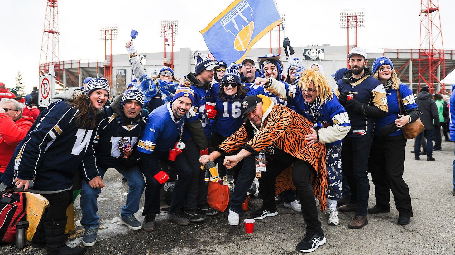 CALGARY, AB - NOVEMBER 24: Winnipeg Blue Bombers fans and a single Hamilton Tiger-Cats fan rally their team prior to the 107th Grey Cup Championship Game against the Hamilton Tiger-Cats during at McMahon Stadium on November 24, 2019 in Calgary, Alberta, Canada. (Photo by Derek Leung/Getty Images)