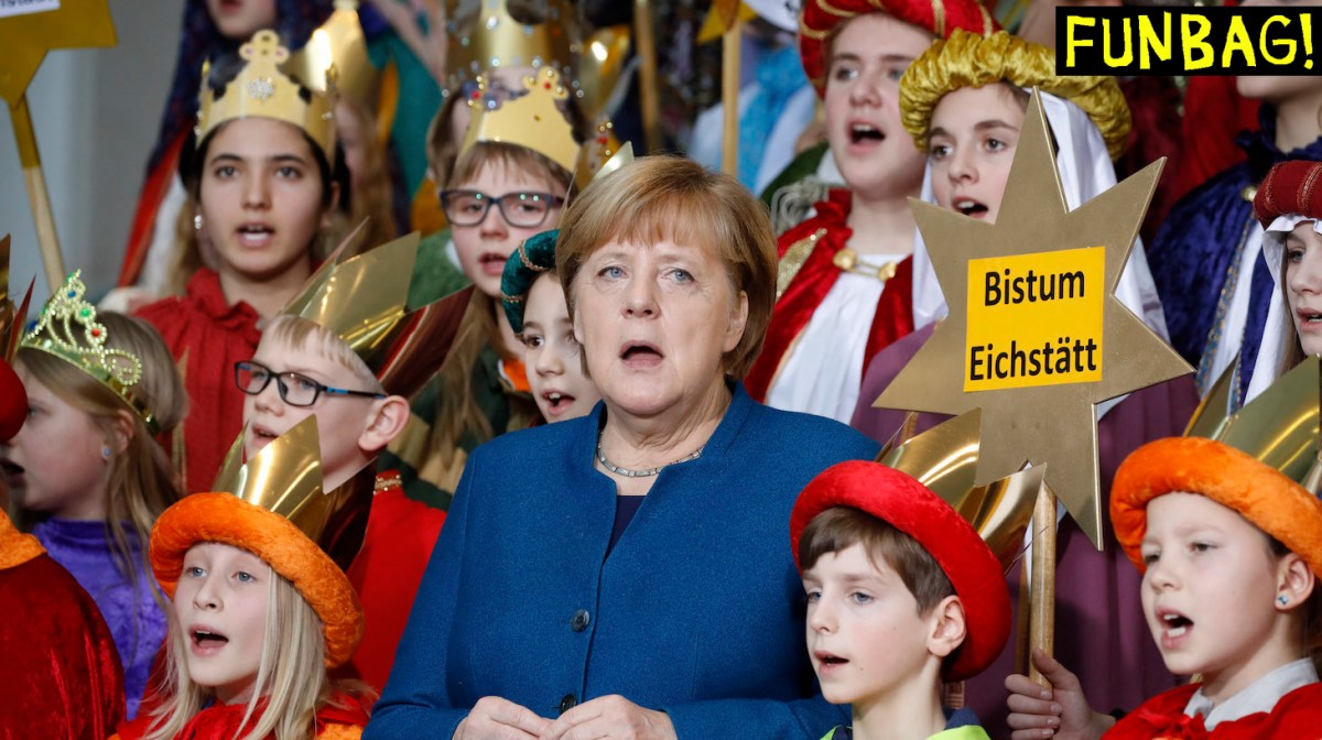 German Chancellor Angela Merkel sings with Carol Singers from across the country during a reception at the Chancellery in Berlin on January 7, 2020. - Traditionally, children dressed as the Three Kings go from house to house after Christmas and before Epiphany to collect money for charitable projects of the Roman Catholic church. (Photo by Odd ANDERSEN / AFP) (Photo by ODD ANDERSEN/AFP via Getty Images)