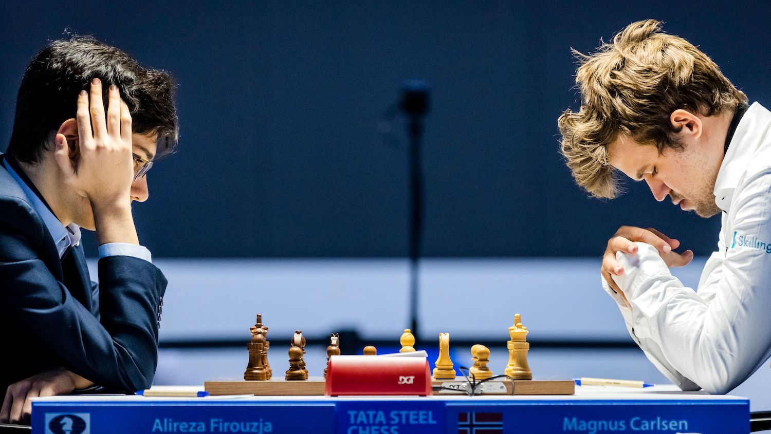 Iranian chess prodigy Alireza Firouzja (L), 17-years-old, plays against Norwegian chess grandmaster who is the current World Chess Champion Magnus Carlsen, 30-years-old, in the first round of the international chess tournament TataSteel Chess Tournament 2021 in Wijk aan Zee on January 16, 2021. (Photo by Remko de Waal / ANP / AFP) / Netherlands OUT (Photo by REMKO DE WAAL/ANP/AFP via Getty Images)