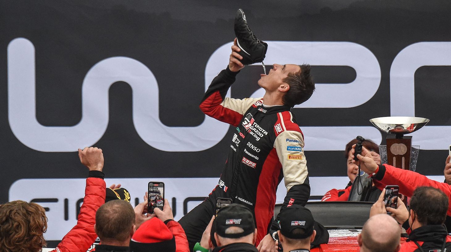 Julien Ingrassia traditionally drinks from a shoe as he celebrates his 8th World title on November 21, 2021 after the ACI Rally Monza 2021