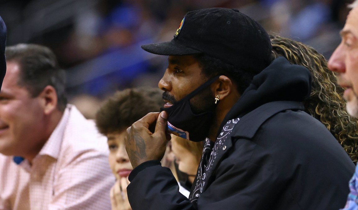 Kyrie Irving of the Brooklyn Nets watches the action between the Wagner Seahawks and the Seton Hall Pirates during the game at Prudential Center on December 1, 2021 in Newark, New Jersey. Seton Hall defeated Wagner 85-63. (Photo by Rich Schultz/Getty Images)