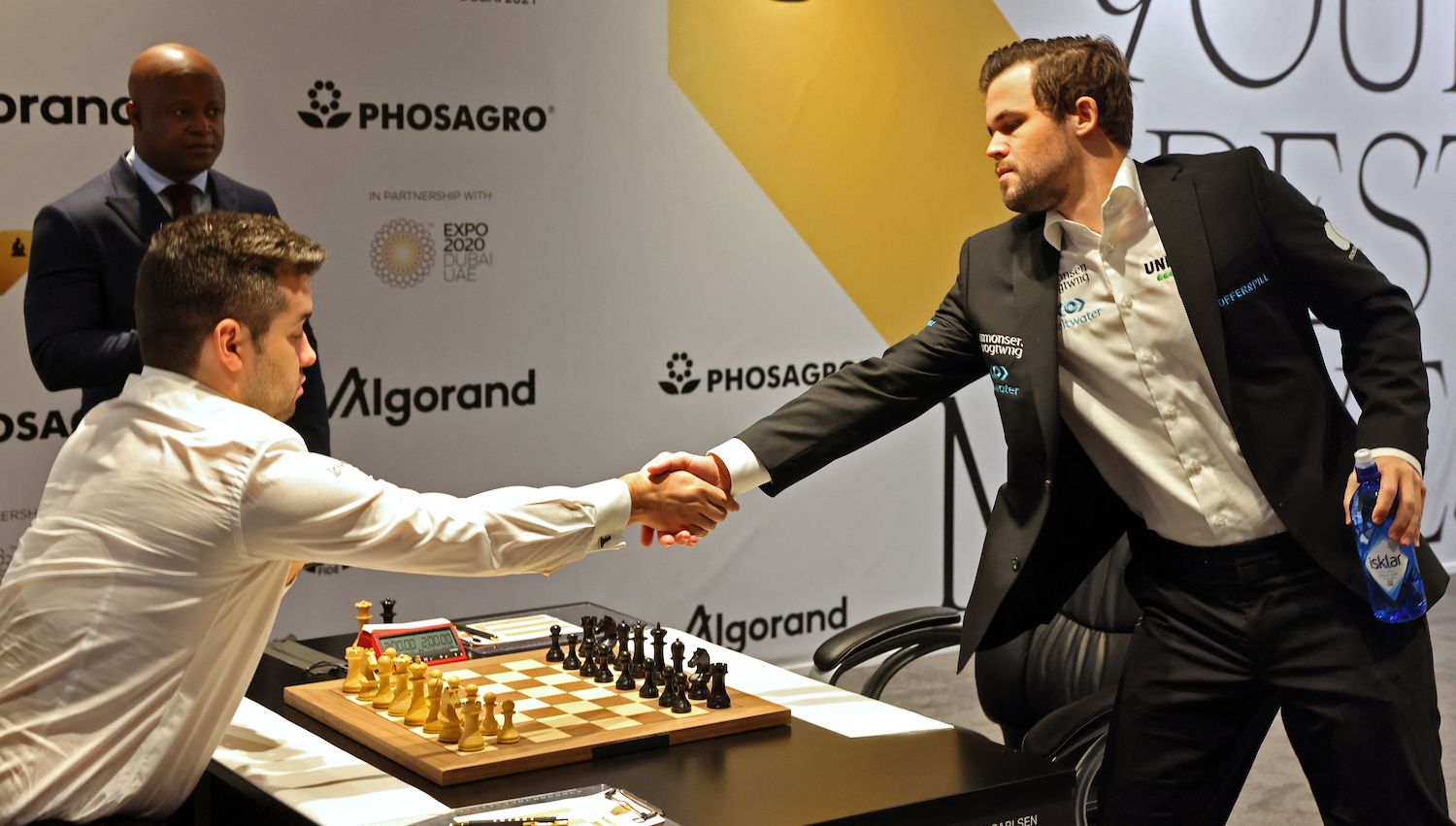 Russia's grandmaster Ian Nepomniachtchi and Norway's grandmaster Magnus Carlsen play game nice during the FIDE World Chess Championship Dubai 2021, at the Dubai Expo 2020 in the Gulf emirate, on December 7, 2021. (Photo by Giuseppe CACACE / AFP) (Photo by GIUSEPPE CACACE/AFP via Getty Images)