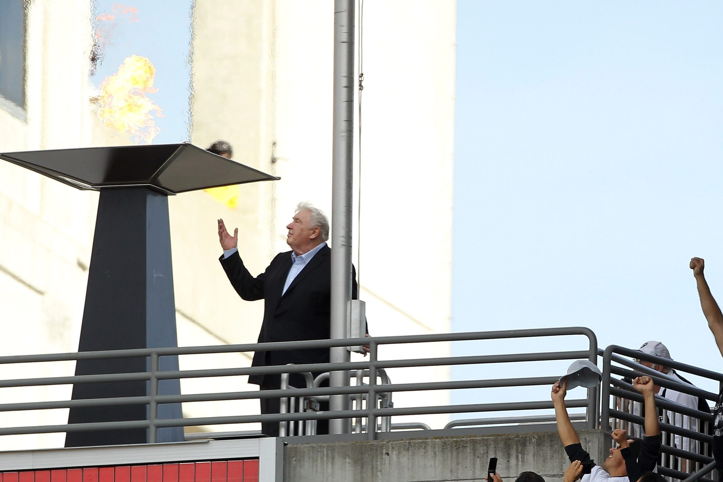 John Madden points to the sky after lighting a flame in the honor of Oakland Raiders owner Al Davis during halftime of their game against the Cleveland Browns at O.co Coliseum on October 16, 2011 in Oakland, California.