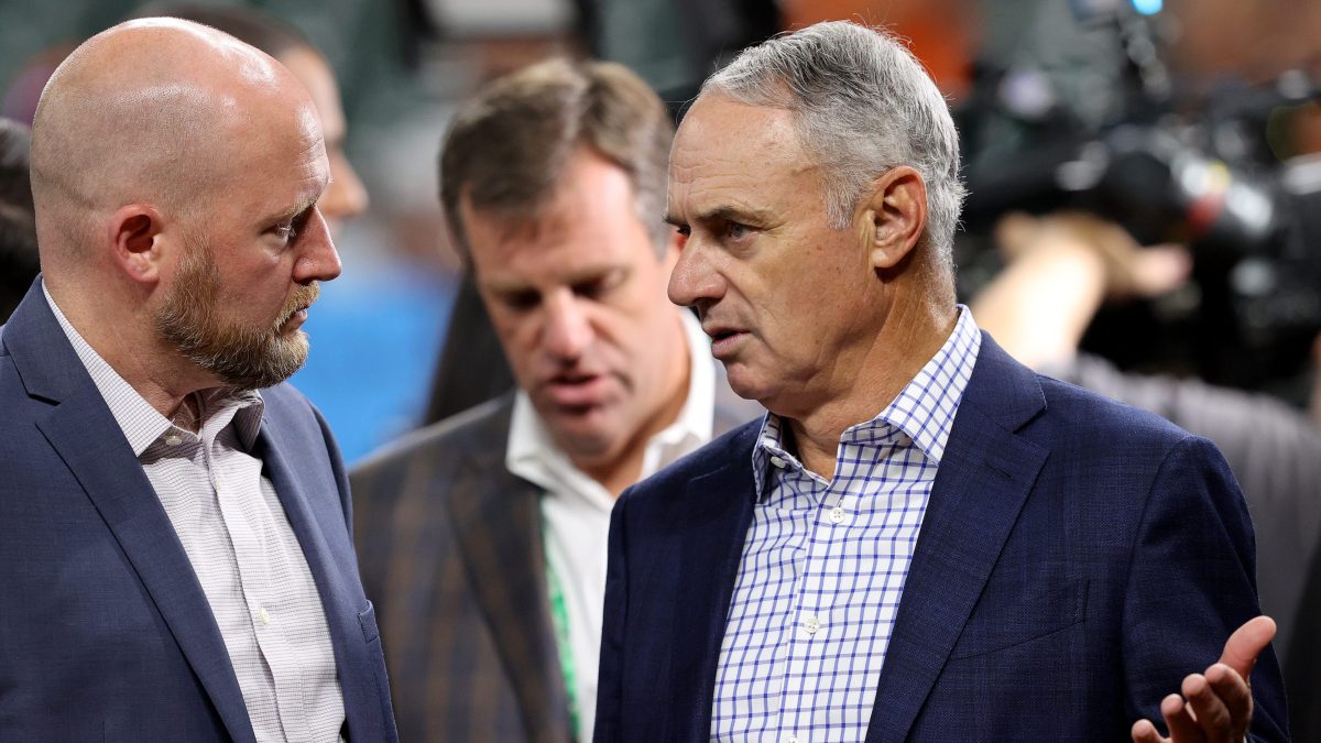 MLB Commissioner Rob Manfred talks to Astros GM James Click during the 2021 World Series.