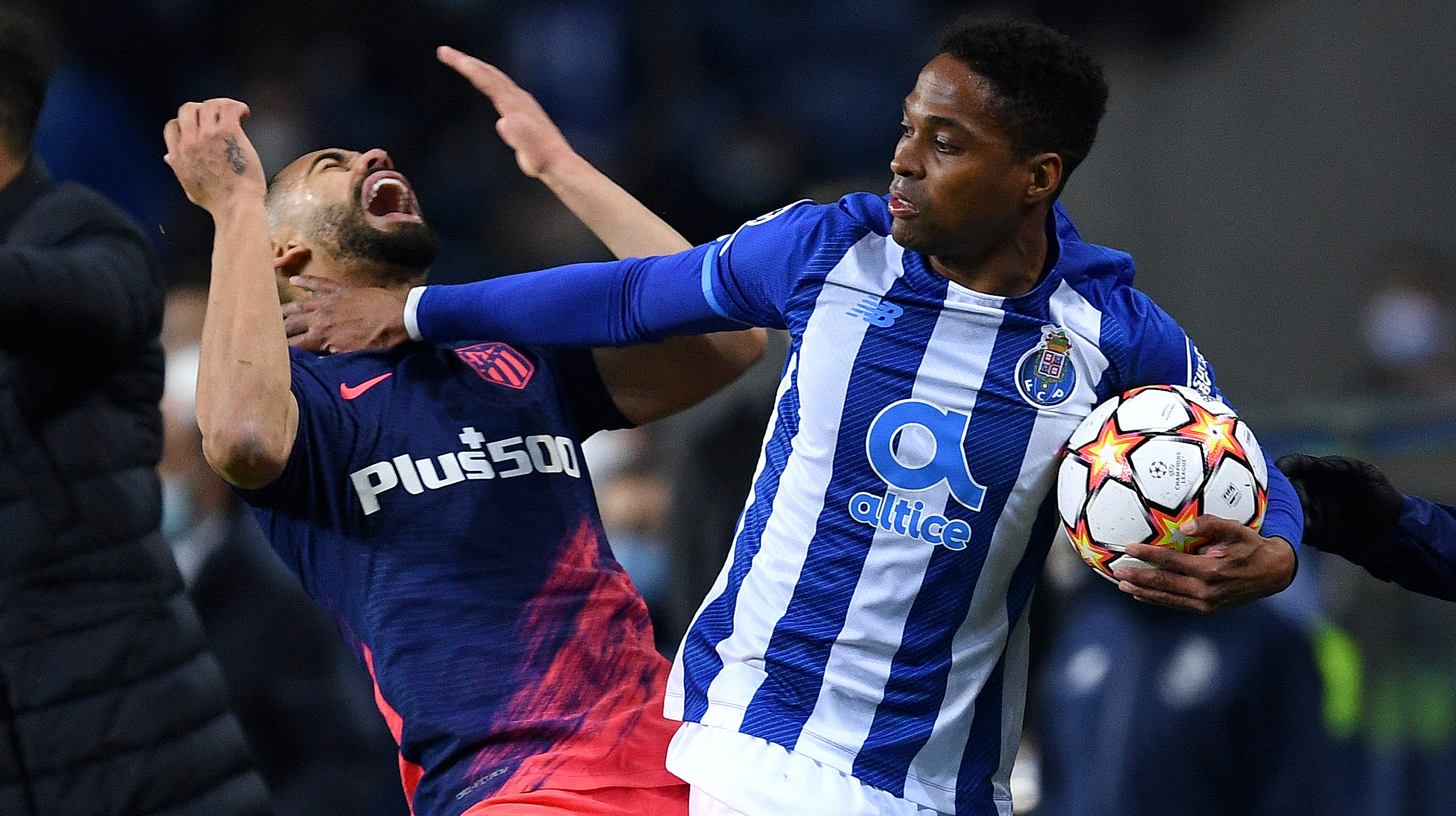Wendell of FC Porto clashes with Matheus Cunha of Atletico Madrid during the UEFA Champions League group B match between FC Porto and Atletico Madrid at Estadio do Dragao on December 07, 2021 in Porto, Portugal.