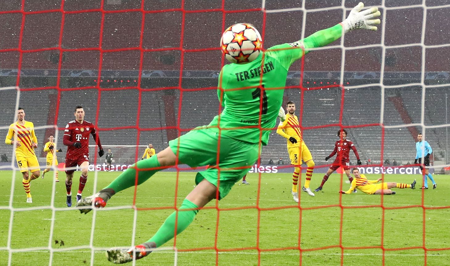 Marc Andre ter Stegen, keeper of FC Barcelona reacts as Leroy Sané of Muenchen scores the second goal during the UEFA Champions League group E match between FC Bayern München and FC Barcelona at Football Arena Munich on December 08, 2021 in Munich, Germany.