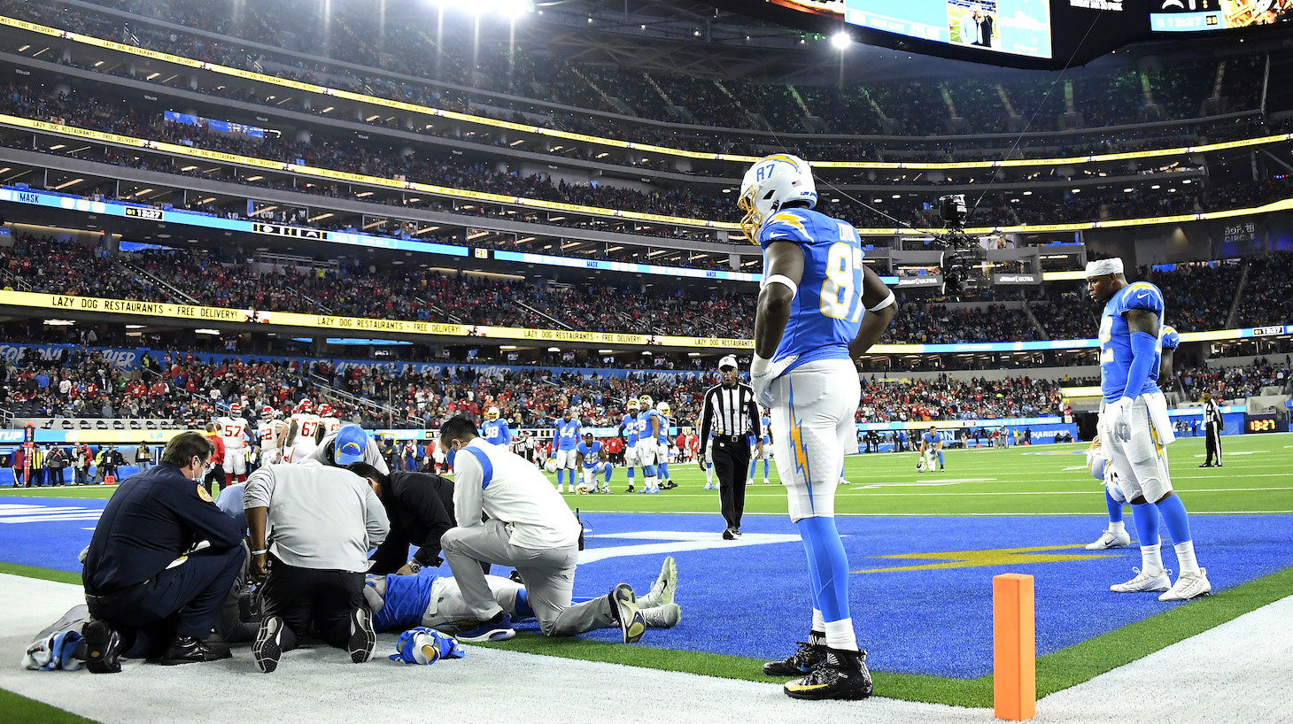 INGLEWOOD, CALIFORNIA - DECEMBER 16: Jared Cook #87 of the Los Angeles Chargers watches as teammate Donald Parham #89 is assessed for injury in the first quarter of the game against the Kansas City Chiefs at SoFi Stadium on December 16, 2021 in Inglewood, California. (Photo by Kevork Djansezian/Getty Images)
