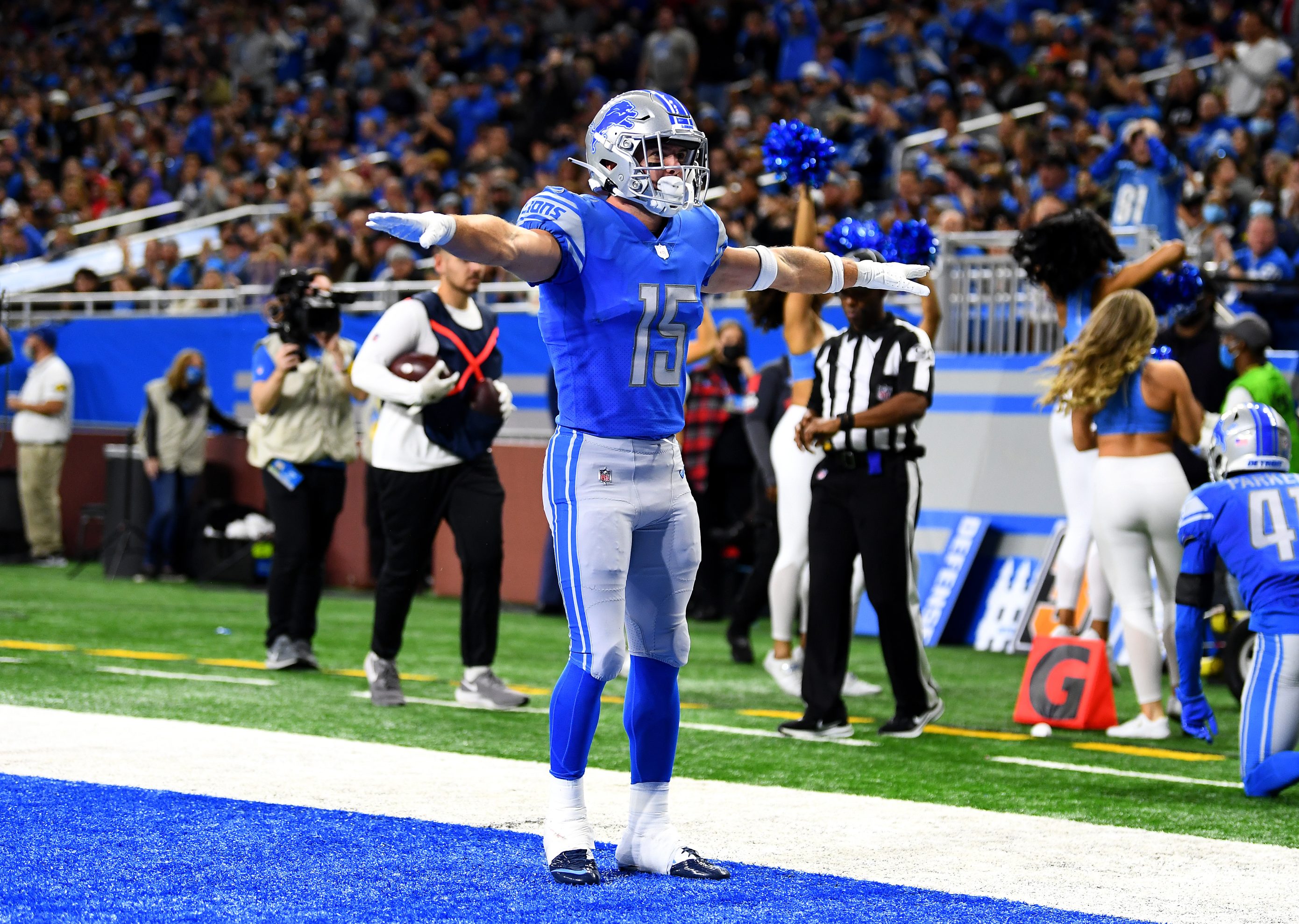 Sage Surratt of the Lions celebrates after an incomplete Cardinals pass in the end zone