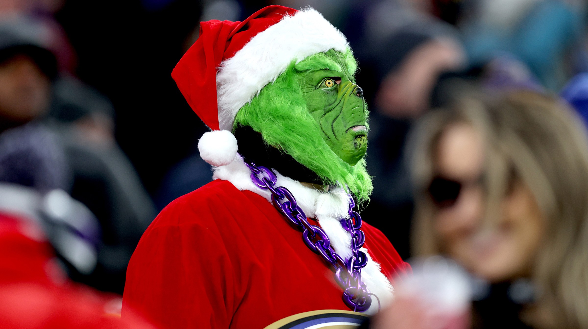 A masked fan of the Baltimore Ravens looks on during the game between the Green Bay Packers and the Baltimore Ravens at M&amp;T Bank Stadium on December 19, 2021 in Baltimore, Maryland.