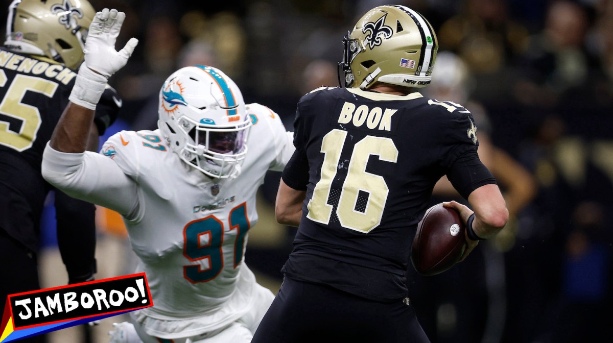 NEW ORLEANS, LOUISIANA - DECEMBER 27: Emmanuel Ogbah #91 of the Miami Dolphins sacks Ian Book #16 of the New Orleans Saints in the fourth quarter of the game at Caesars Superdome on December 27, 2021 in New Orleans, Louisiana. (Photo by Chris Graythen/Getty Images)