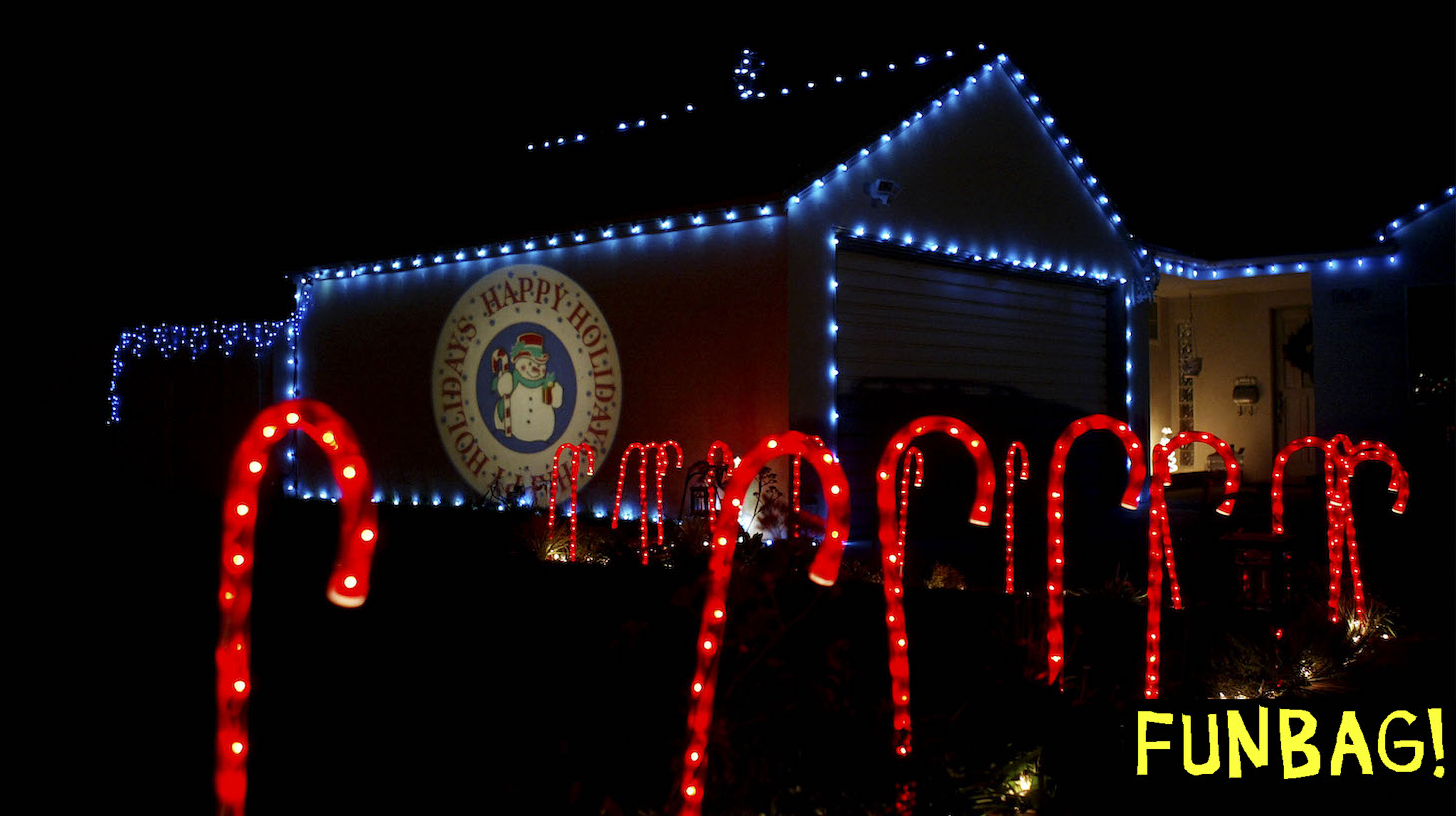 PASADENA, CA, DECEMBER 17: Candy Cane lights and a projected "Happy Holidays" wish adorn a house on December 17, 2003 in Pasadena, California. Many of southern California's better holiday lights displays are in Pasadena. (Photo by David McNew/Getty Images)