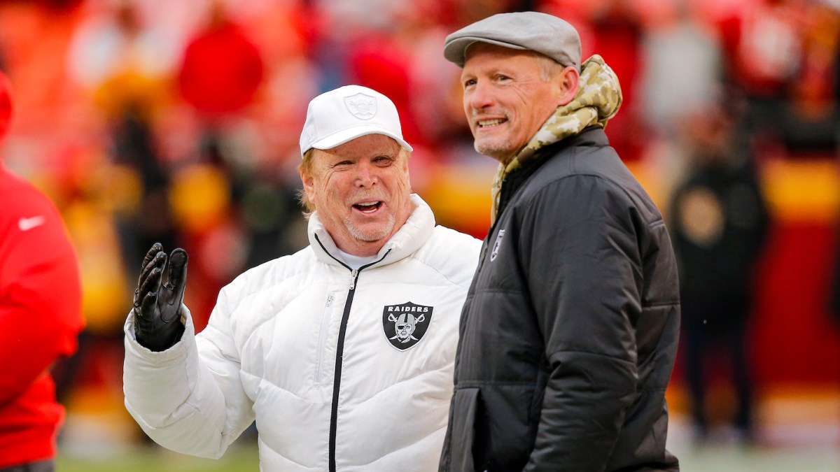 KANSAS CITY, MO - DECEMBER 01: Oakland Raiders owner Mark Davis laughs while talking to Raiders general manager Mike Mayock during pregame warmups prior to the game against the Kansas City Chiefs at Arrowhead Stadium on December 1, 2019 in Kansas City, Missouri. (Photo by David Eulitt/Getty Images)