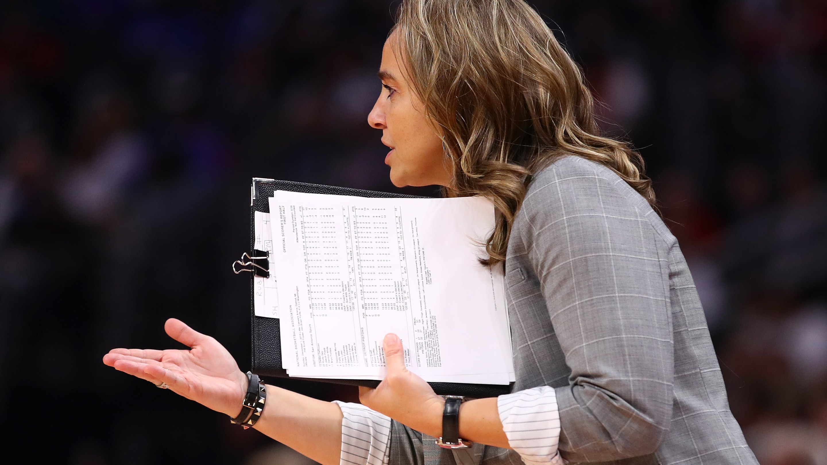 Assistant coach Becky Hammon reacts from the bench while playing the Detroit Pistons at Little Caesars Arena on December 01, 2019 in Detroit, Michigan. Detroit won the game 132-98. NOTE TO USER: User expressly acknowledges and agrees that, by downloading and or using this photograph, User is consenting to the terms and conditions of the Getty Images License Agreement.