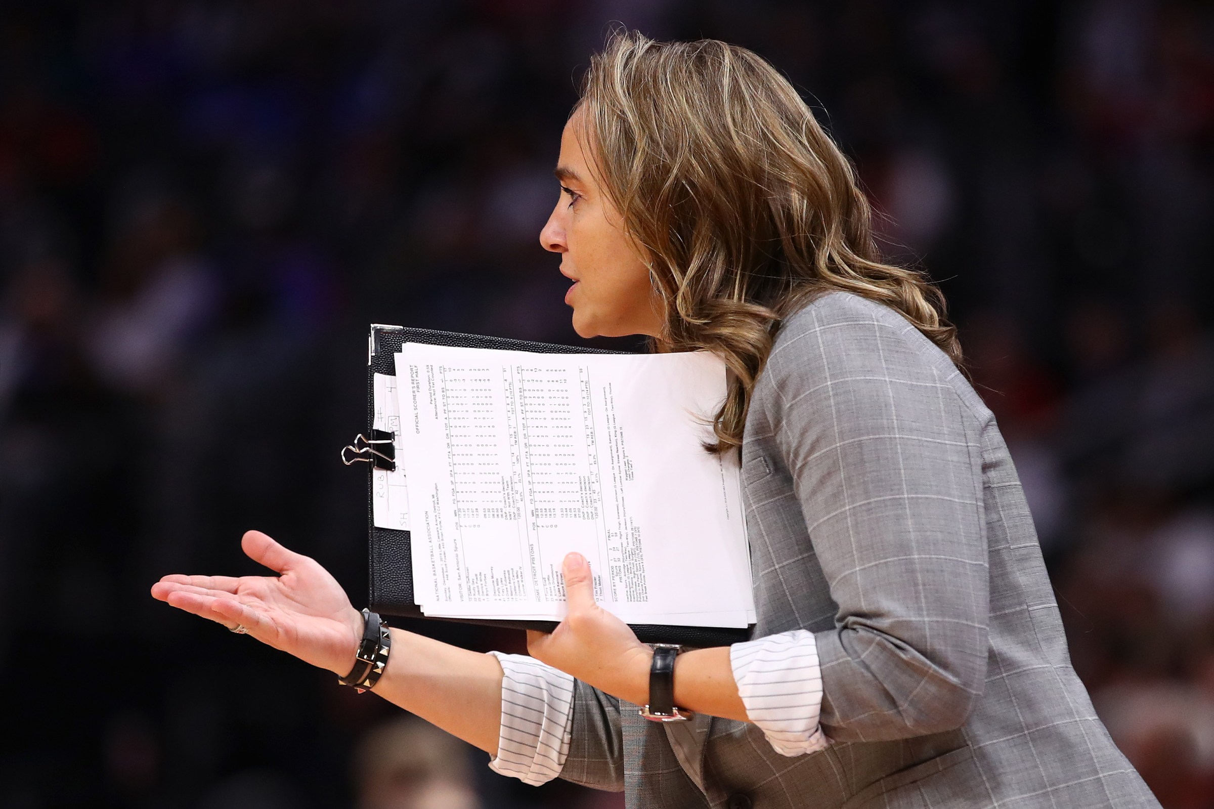 Assistant coach Becky Hammon reacts from the bench while playing the Detroit Pistons at Little Caesars Arena on December 01, 2019 in Detroit, Michigan. Detroit won the game 132-98. NOTE TO USER: User expressly acknowledges and agrees that, by downloading and or using this photograph, User is consenting to the terms and conditions of the Getty Images License Agreement.