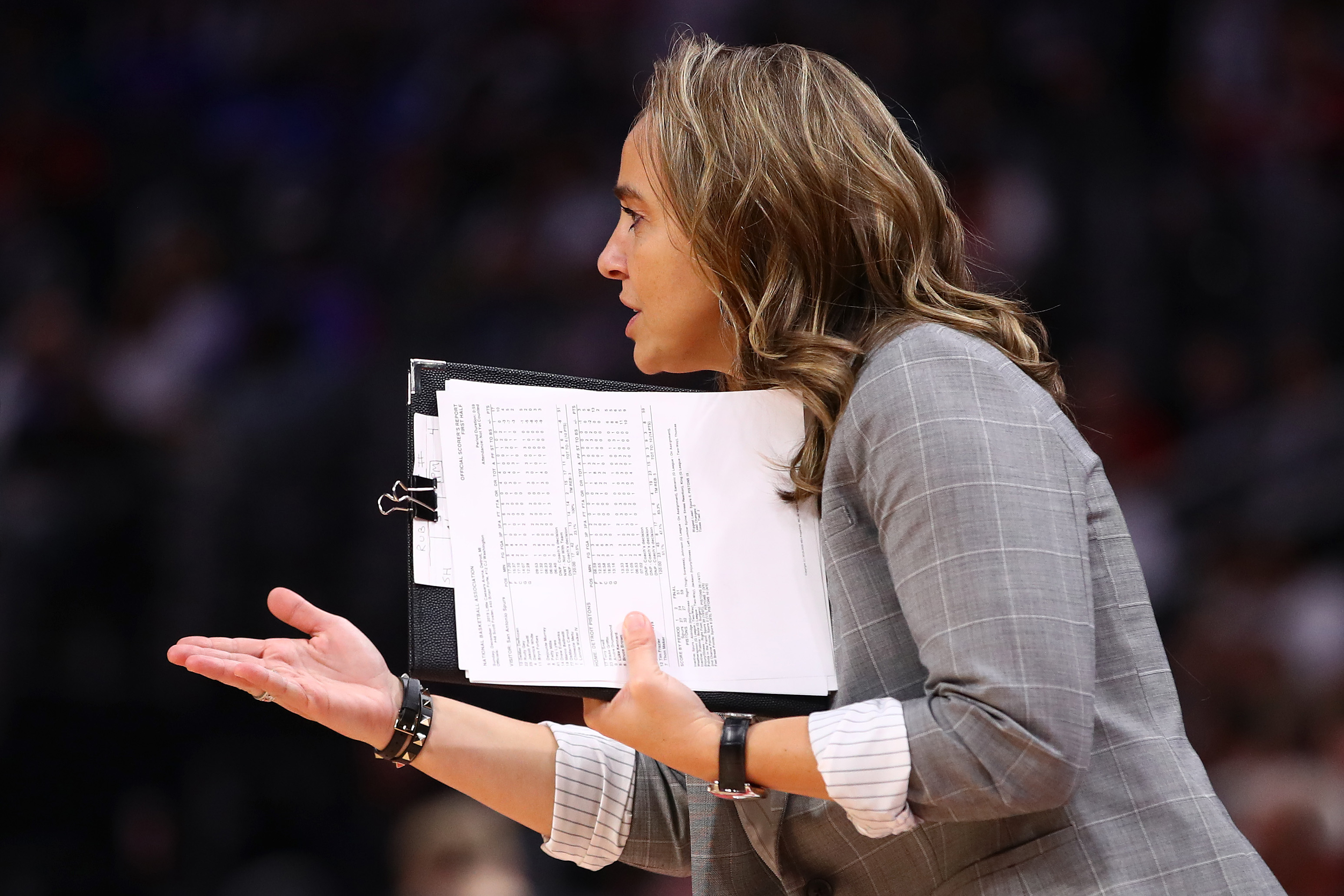 Assistant coach Becky Hammon reacts from the bench while playing the Detroit Pistons at Little Caesars Arena on December 01, 2019 in Detroit, Michigan. Detroit won the game 132-98. NOTE TO USER: User expressly acknowledges and agrees that, by downloading and or using this photograph, User is consenting to the terms and conditions of the Getty Images License Agreement.