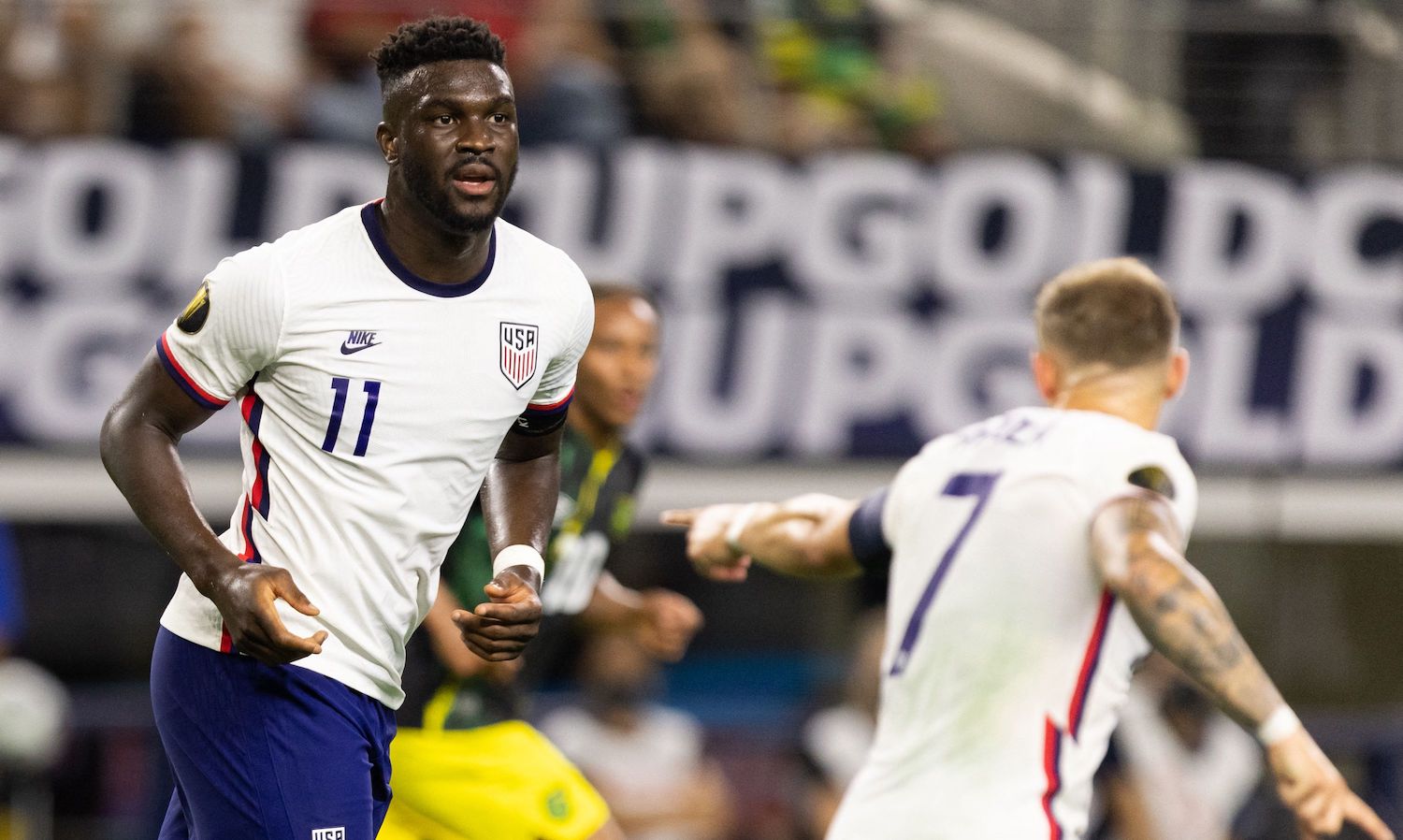 USA's forward Paul Arriola (R) points to forward Daryl Dike (L) after an opportunity during the Concacaf Gold Cup quarterfinal football match between USA and Jamaica at the AT&amp;T stadium in Arlington, Texas on July 25, 2021. (Photo by Andy JACOBSOHN / AFP) (Photo by ANDY JACOBSOHN/AFP via Getty Images)