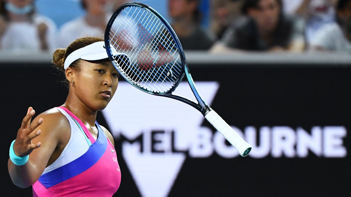 Japan's Naomi Osaka bounces her racquet as she plays against Amanda Anisimova of the US during their women's singles match on day five of the Australian Open tennis tournament in Melbourne on January 21, 2022.