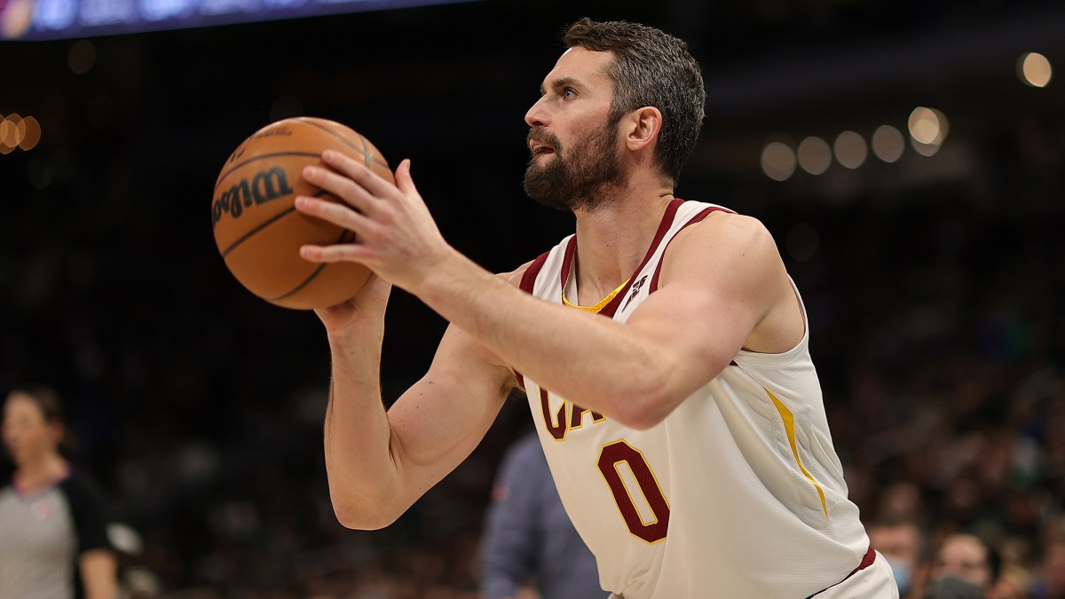 Kevin Love #0 of the Cleveland Cavaliers takes a three point shot during the second half of a game against the Milwaukee Bucks at Fiserv Forum on December 06, 2021 in Milwaukee, Wisconsin.