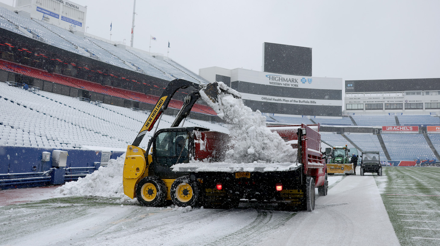 A snow plow clears the field of snow before the start of a game between the Atlanta Falcons and the Buffalo Bills at Highmark Stadium on January 02, 2022 in Orchard Park, New York.