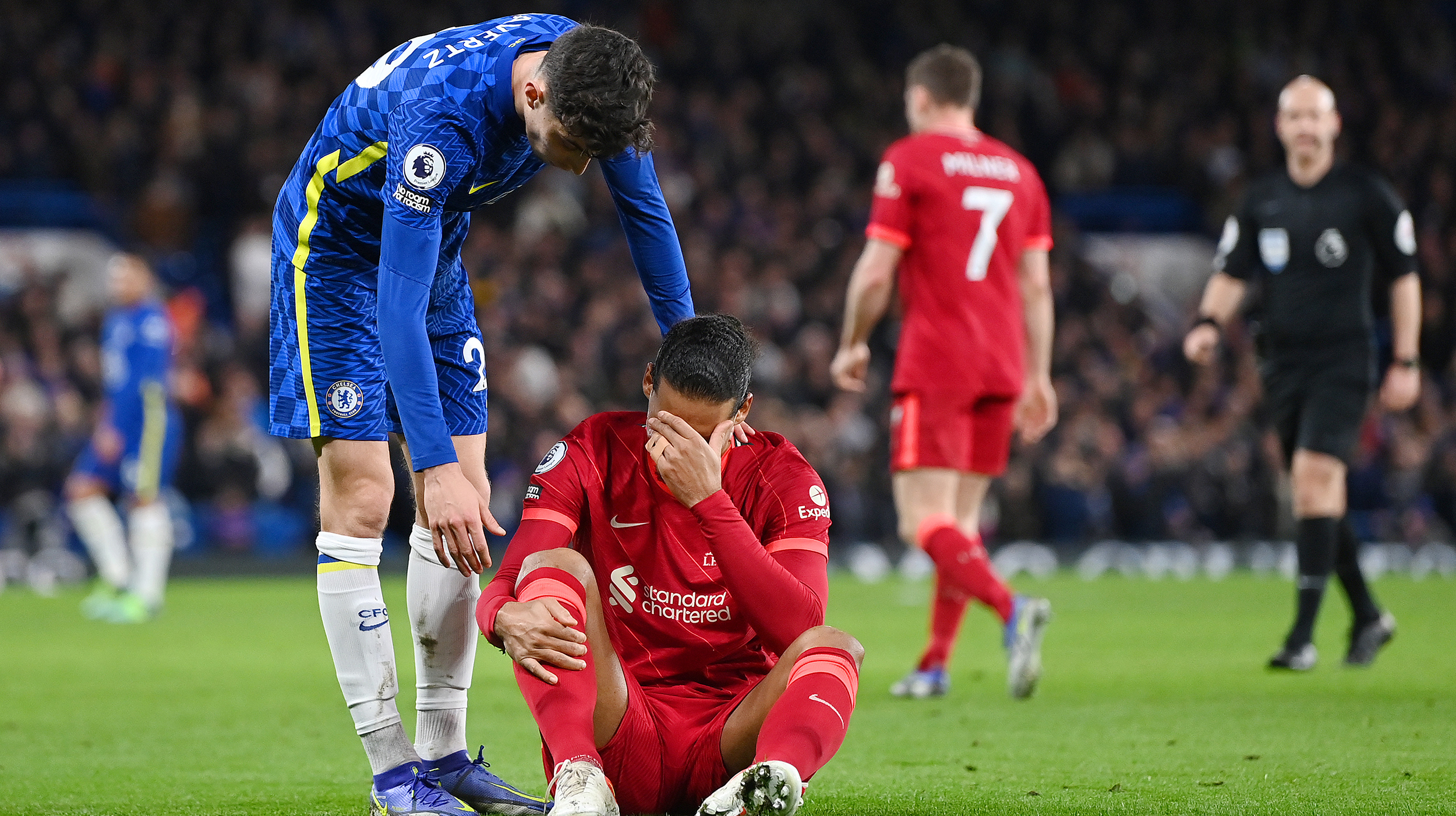 Kai Havertz of Chelsea interacts with Virgil van Dijk of Liverpool during the Premier League match between Chelsea and Liverpool at Stamford Bridge on January 02, 2022 in London, England.