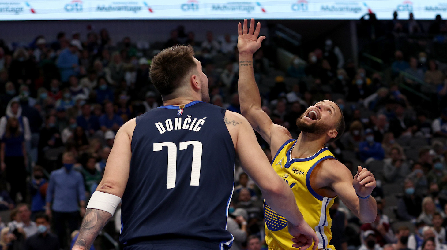 DALLAS, TEXAS - JANUARY 05: Stephen Curry #30 of the Golden State Warriors reacts after being fouled by Luka Doncic #77 of the Dallas Mavericks in the third quarter at American Airlines Center on January 05, 2022 in Dallas, Texas. NOTE TO USER: User expressly acknowledges and agrees that, by downloading and or using this photograph, User is consenting to the terms and conditions of the Getty Images License Agreement. (Photo by Tom Pennington/Getty Images)