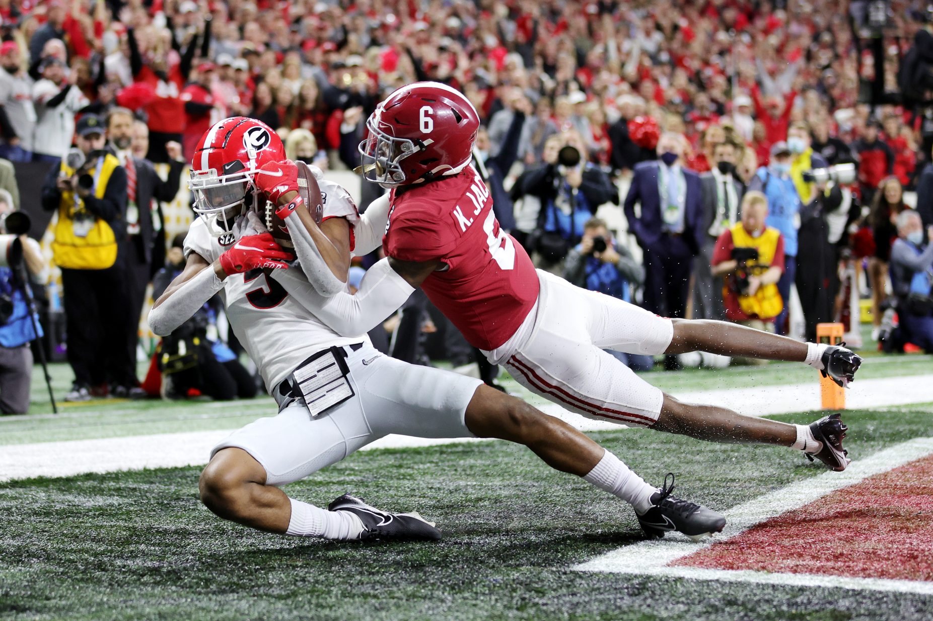 Adonai Mitchell catches the ball for a touchdown