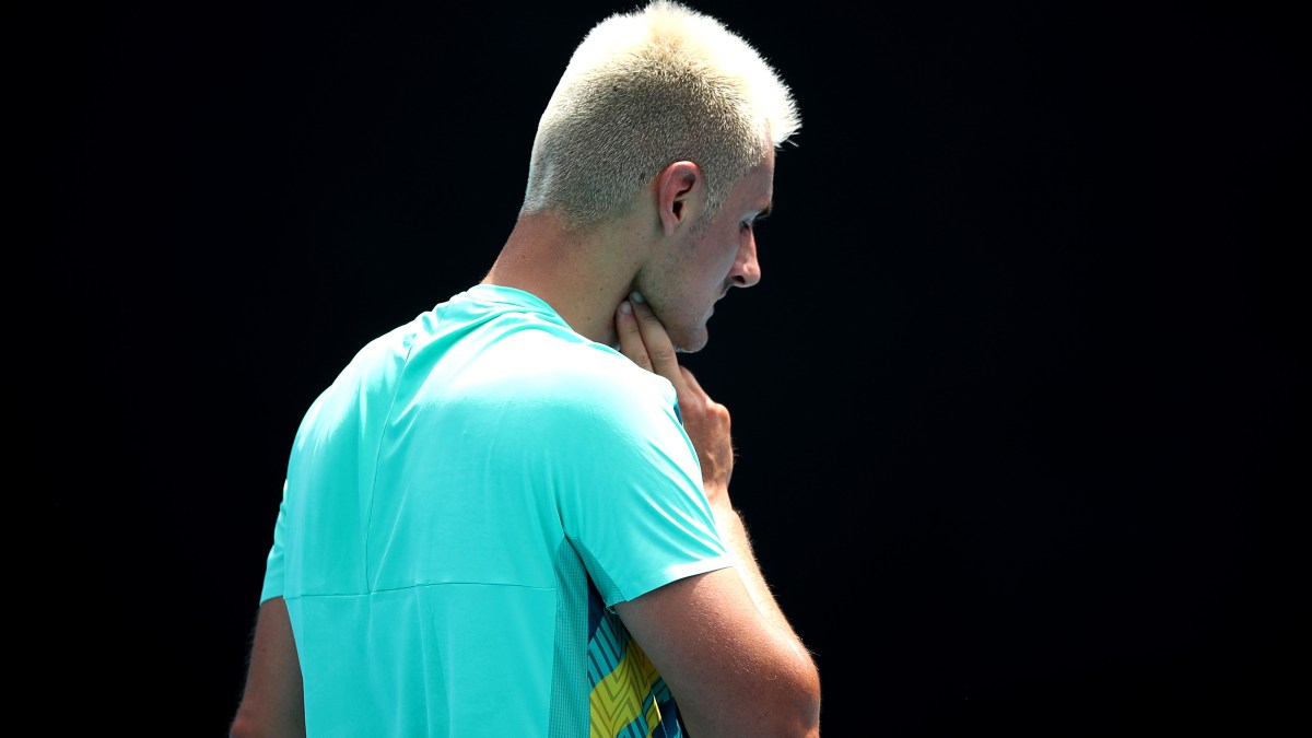 Bernard Tomic checks his pulse during his qualifying match for the Australian Open.