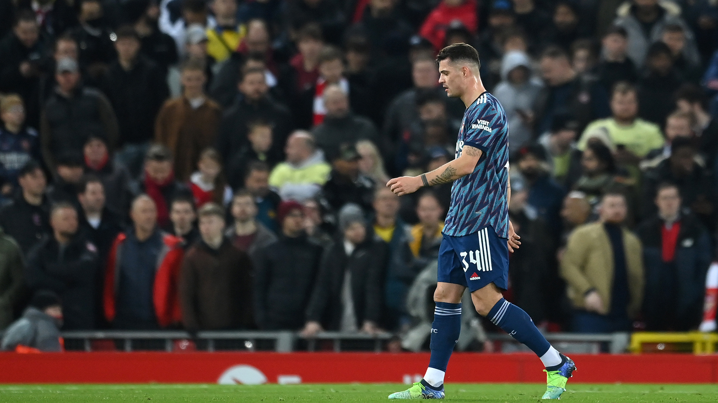 Granit Xhaka of Arsenal leaves the field of play after being sent off during the Carabao Cup Semi Final First Leg match between Liverpool and Arsenal at Anfield on January 13, 2022 in Liverpool, England.
