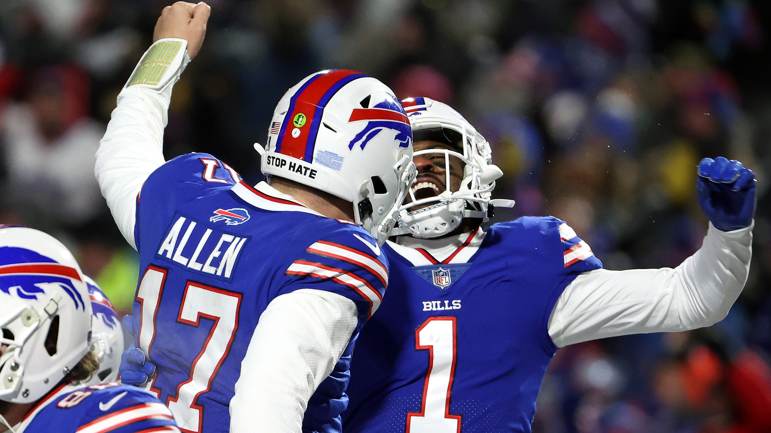 Josh Allen #17 and Emmanuel Sanders #1 of the Buffalo Bills celebrates a touchdown against New England Patriots during the third quarter in the AFC Wild Card playoff game at Highmark Stadium on January 15, 2022 in Buffalo, New York.