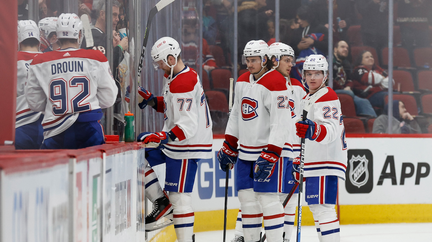 GLENDALE, ARIZONA - JANUARY 17: Brett Kulak #77, Alexander Romanov #27 and Cole Caufield #22 of the Montreal Canadiens skate off the ice following the NHL game against the Arizona Coyotes at Gila River Arena on January 17, 2022 in Glendale, Arizona. The Coyotes defeated the Canadiens 5-2. (Photo by Christian Petersen/Getty Images)