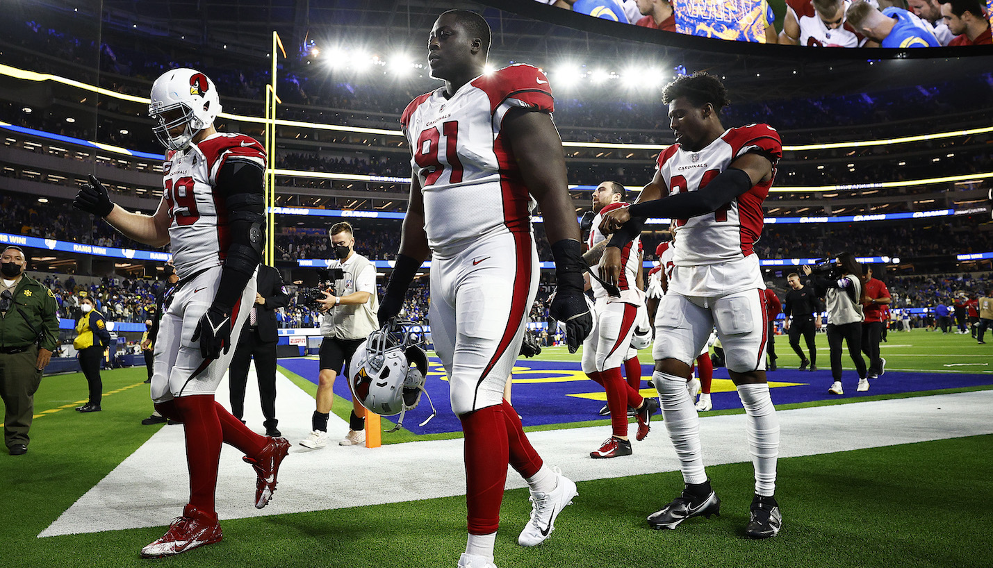 INGLEWOOD, CALIFORNIA - JANUARY 17: Michael Dogbe #91 of the Arizona Cardinals walks off the field after losing to the Los Angeles Rams 34-11 in the NFC Wild Card Playoff game at SoFi Stadium on January 17, 2022 in Inglewood, California. (Photo by Ronald Martinez/Getty Images)