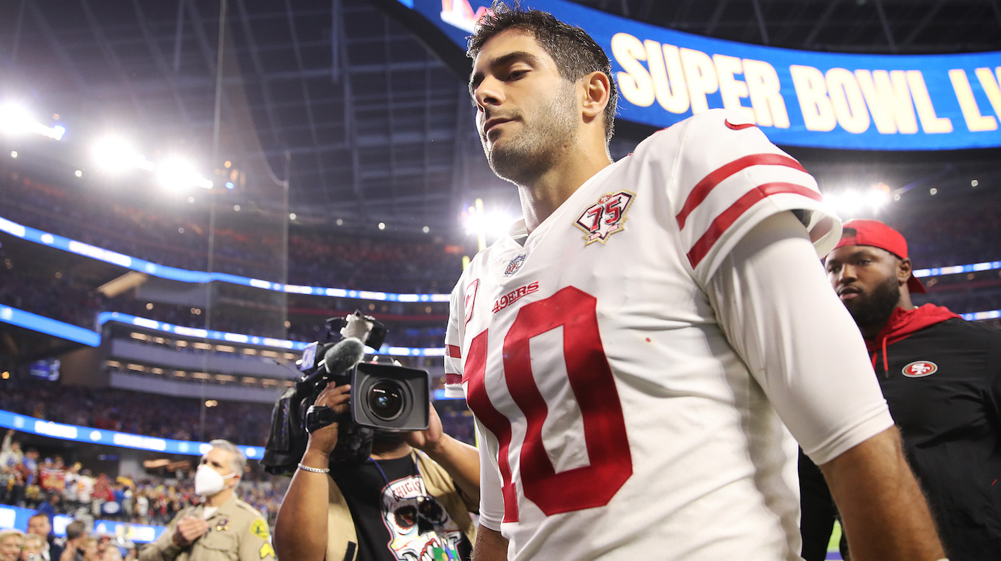 INGLEWOOD, CALIFORNIA - JANUARY 30: Jimmy Garoppolo #10 of the San Francisco 49ers walks off the field after being defeated by the Los Angeles Rams in the NFC Championship Game at SoFi Stadium on January 30, 2022 in Inglewood, California. The Rams defeated the 49ers 20-17. (Photo by Christian Petersen/Getty Images)