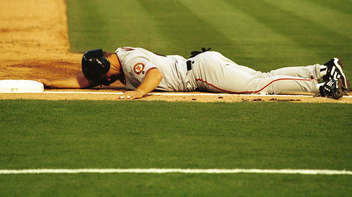 3 Apr 2000: Jeff Kent # 21 of the San Francisco Giants lies on his stomach after being tagged out at third base in the second inning at Pro Player Stadium in Miami Florida.