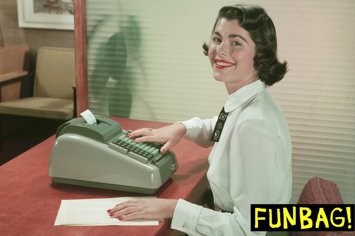 A young woman smiles as she poses at a desk in an office-like environment, one hand on a document and the other on the keys of a Clary adding machine, mid to late 1950s. (Photo by Tom Kelley/Getty Images)
