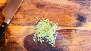 Teeny lil' cubes of celery on a cutting board