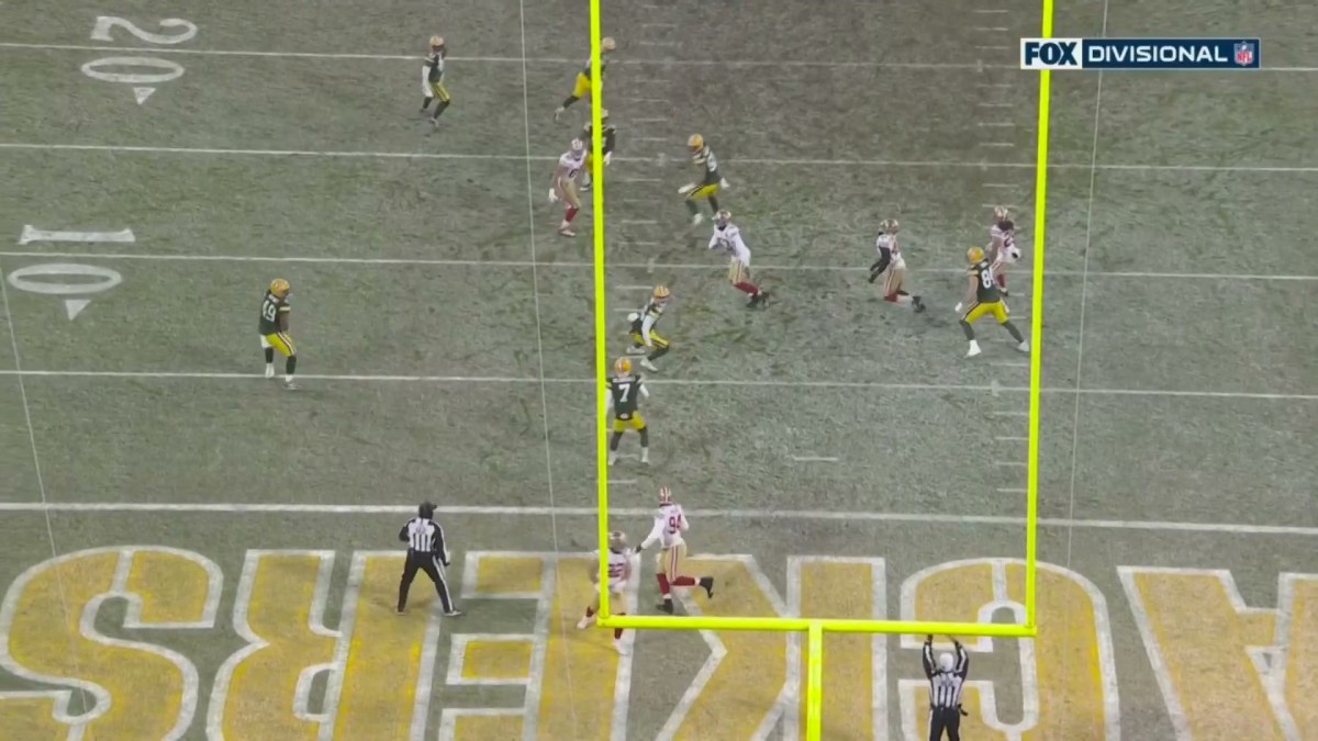 The 49ers and Packers look around for the ball after a punt block