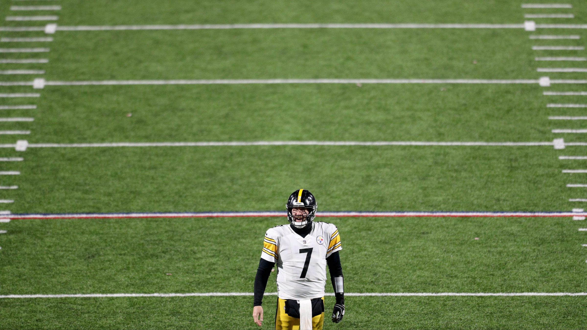 Steelers quarterback Ben Roethlisberger stands on a football field by himself.