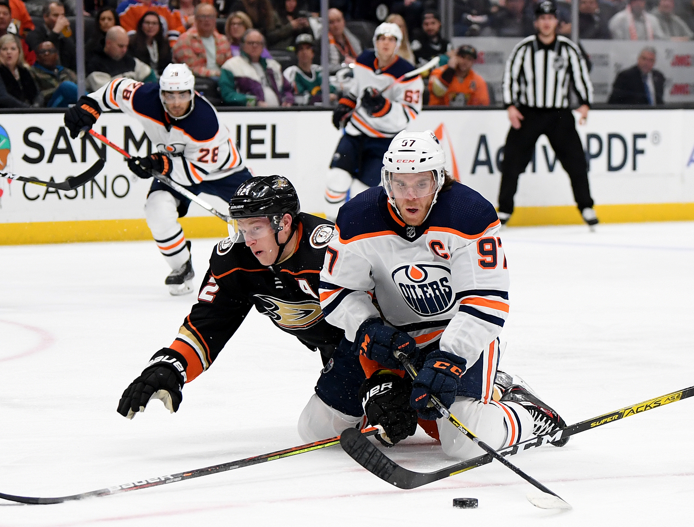 Connor McDavid falls with Josh Manson