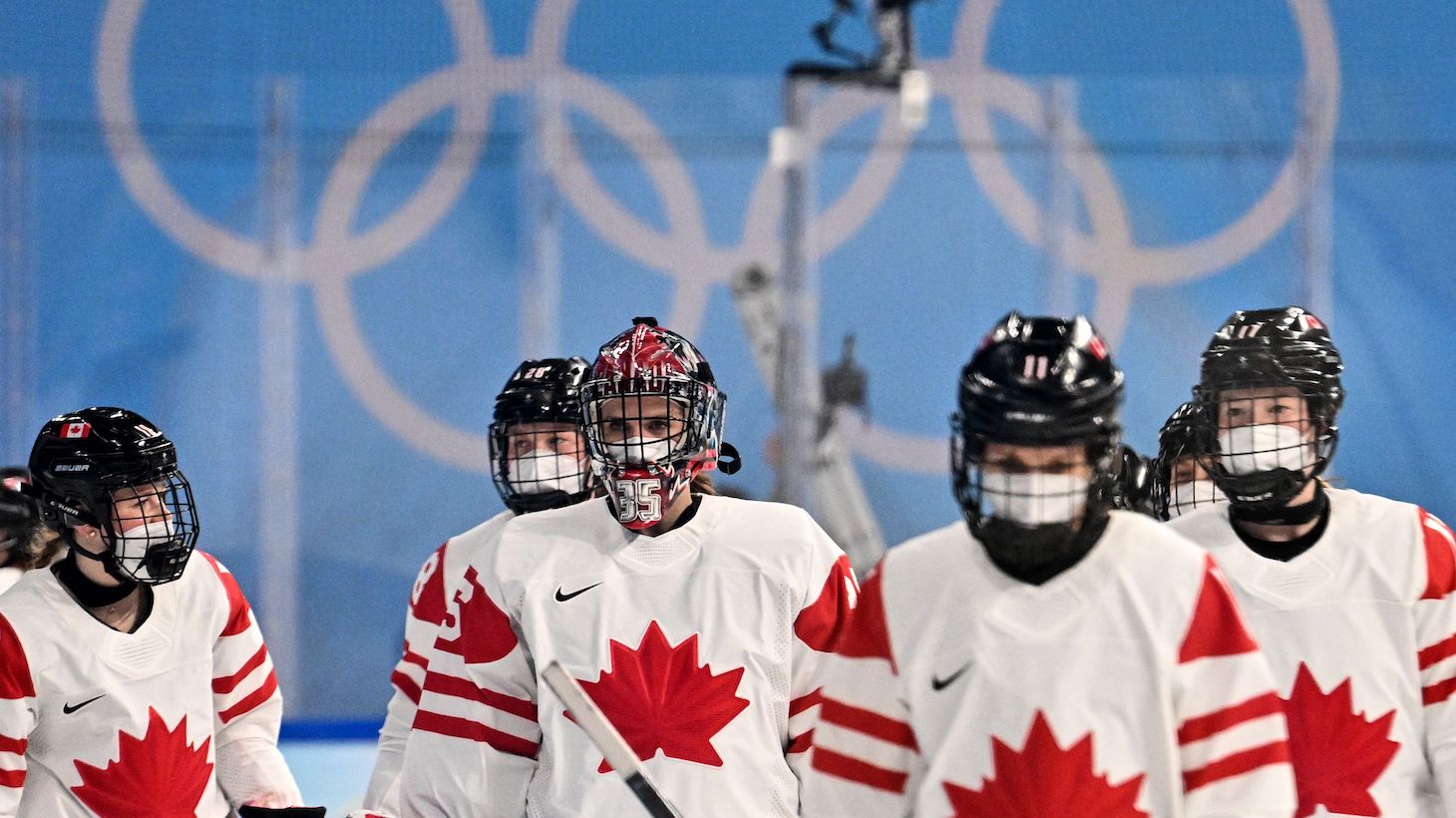 Canada's players react during the women's preliminary round group A match of the Beijing 2022 Winter Olympic Games ice hockey competition players of Russia's Olympic Committee and Canada, at the Wukesong Sports Centre in Beijing on February 7, 2022. (Photo by ANTHONY WALLACE / AFP) (Photo by ANTHONY WALLACE/AFP via Getty Images)