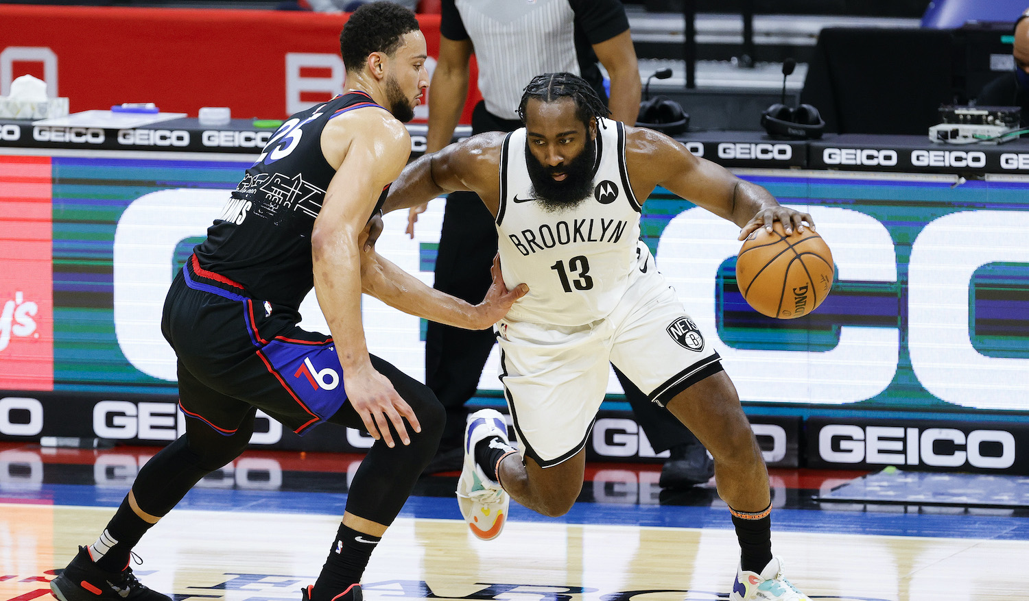 PHILADELPHIA, PENNSYLVANIA - FEBRUARY 06: James Harden #13 of the Brooklyn Nets drives against Ben Simmons #25 of the Philadelphia 76ers during the third quarter at Wells Fargo Center on February 06, 2021 in Philadelphia, Pennsylvania. NOTE TO USER: User expressly acknowledges and agrees that, by downloading and or using this photograph, User is consenting to the terms and conditions of the Getty Images License Agreement. (Photo by Tim Nwachukwu/Getty Images)
