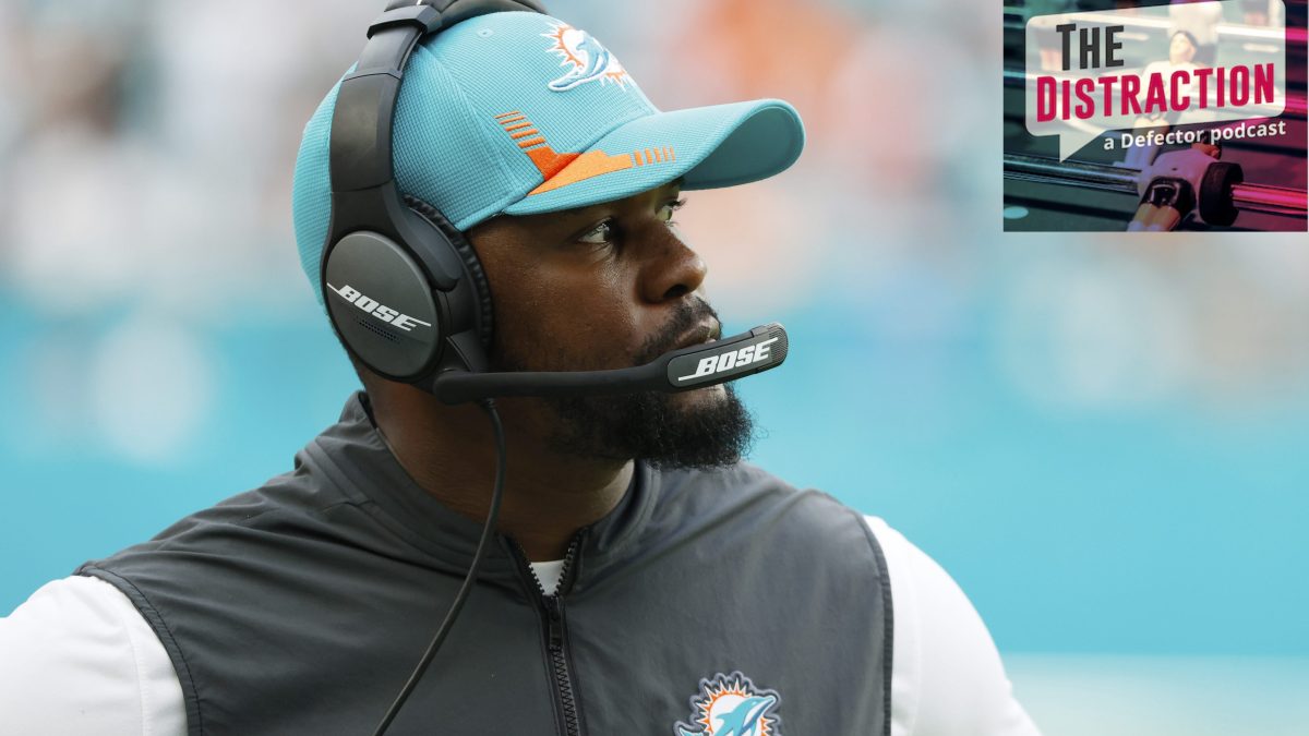 Brian Flores coaching for the Miami Dolphins, also seemingly glowering at The Distraction logo.