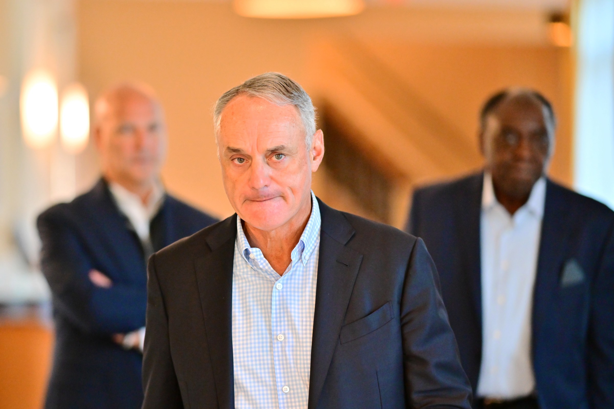 MLB commissioner Rob Manfred leaving the MLB owners meetings with that look on his face.