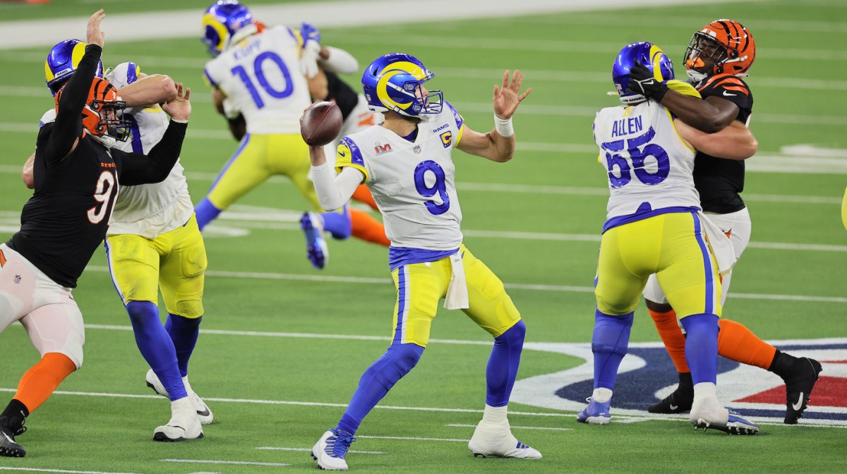 INGLEWOOD, CALIFORNIA - FEBRUARY 13: Matthew Stafford #9 of the Los Angeles Rams looks to throw the ball in the fourth quarter of the game against the Cincinnati Bengals during Super Bowl LVI at SoFi Stadium on February 13, 2022 in Inglewood, California. (Photo by Andy Lyons/Getty Images)