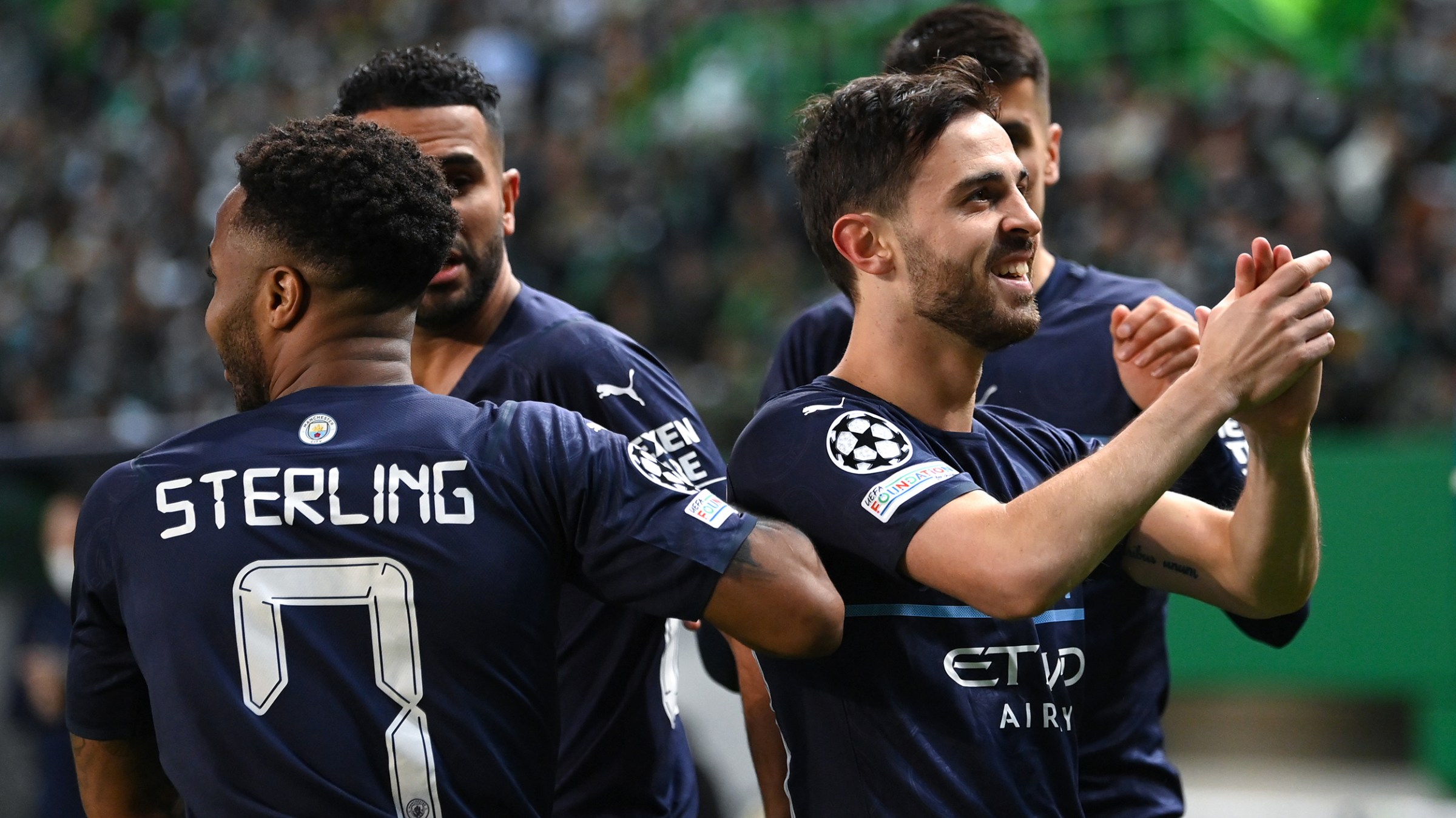 Bernardo Silva of Manchester City applauds the Manchester City fans during the UEFA Champions League Round Of Sixteen Leg One match between Sporting CP and Manchester City at Estadio Jose Alvalade on February 15, 2022 in Lisbon, Portugal.