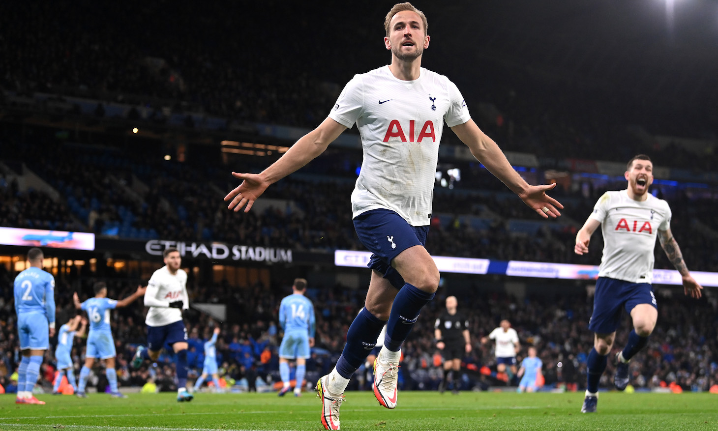 Harry Kane of Tottenham Hotspur celebrates after scoring their side's third goal during the Premier League match between Manchester City and Tottenham Hotspur at Etihad Stadium on February 19, 2022 in Manchester, England.