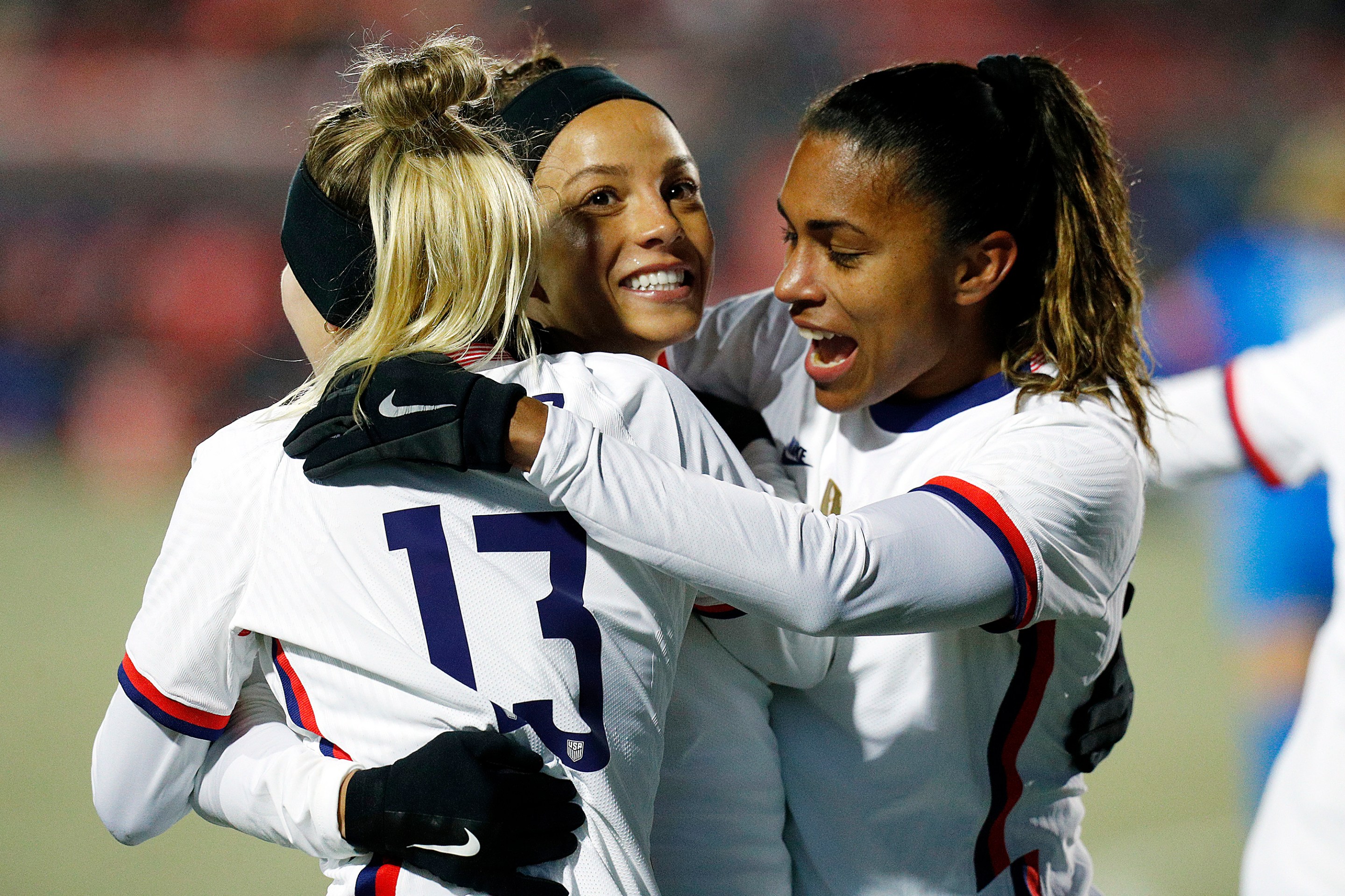 FRISCO, TEXAS - FEBRUARY 23: Mallory Pugh #9 of the USA celebrates with Ashley Sanchez #13 and Catarina Macario #20 after scoring against Iceland in the second half during the 2022 SheBelieves Cup at Toyota Stadium on February 23, 2022 in Frisco, Texas.