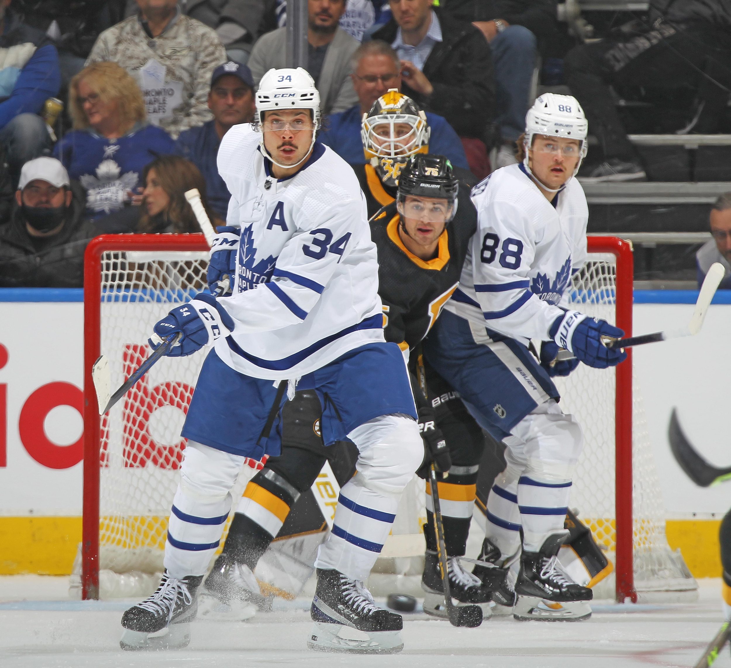 Auston Matthews screens a Bruins goalie